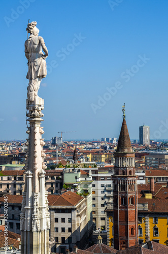 Aerial view of Milan from Duomo roof terrace, Italy. Visible Bell Tower in San Gottardo in Corte. © Dmytro