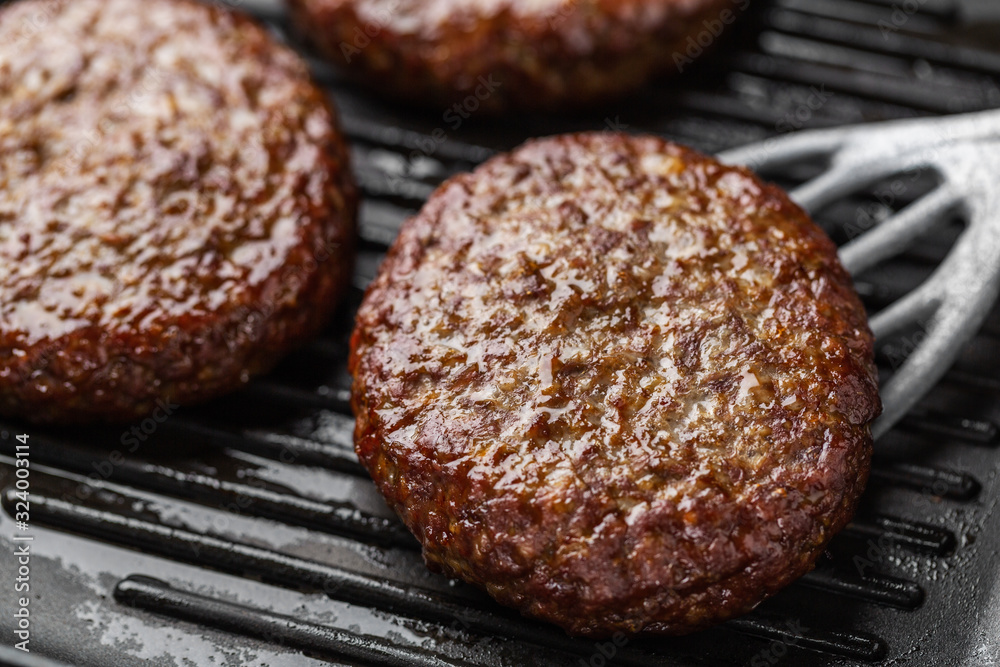 Cooking process of beef patties on pan Cooking process of beef patties on pan