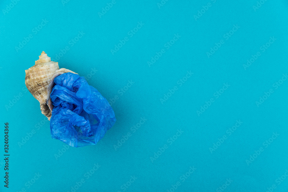 Plastic pollution in ocean concept. Carrier bags in sea shell. Shellfish in bad ecology concept. Plastic pollution in ocean concept. Carrier bags in sea shell. Shellfish in bad ecology concept.