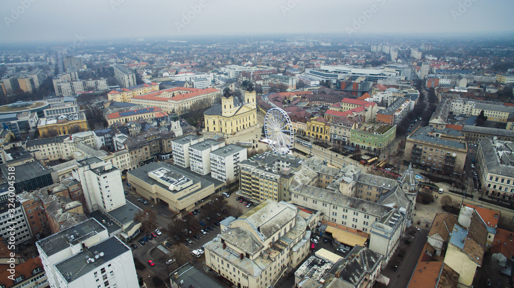 Aerial of downtown Debrecen during hazy day. Kossuth square at winter.