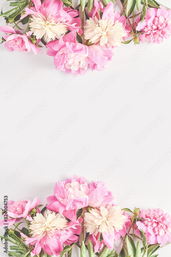 Wedding concept. beautiful frame of pink peony flowers on a white background. top view, flat lay