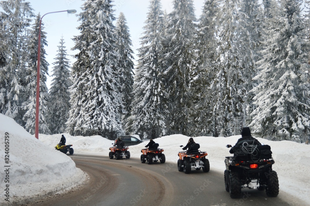 four wheelers on a mountain road