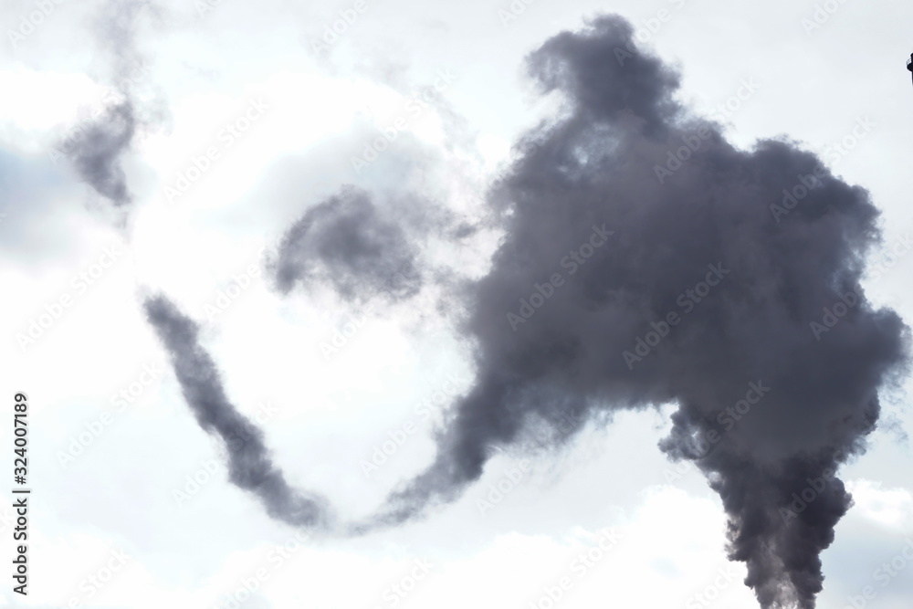 loud of black smoke against blue sky. Industrial city. problem harmful emissions and air pollution of central heating, eco, global warming loud of black smoke against blue sky. Industrial city. problem harmful emissions and air pollution of central heating, eco, global warming