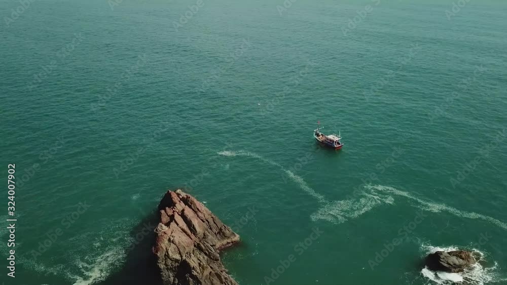 a flying camera flies beautifully over a rocky seashore overlooking the islands and mountains in Vietnam a flying camera flies beautifully over a rocky seashore overlooking the islands and mountains in Vietnam