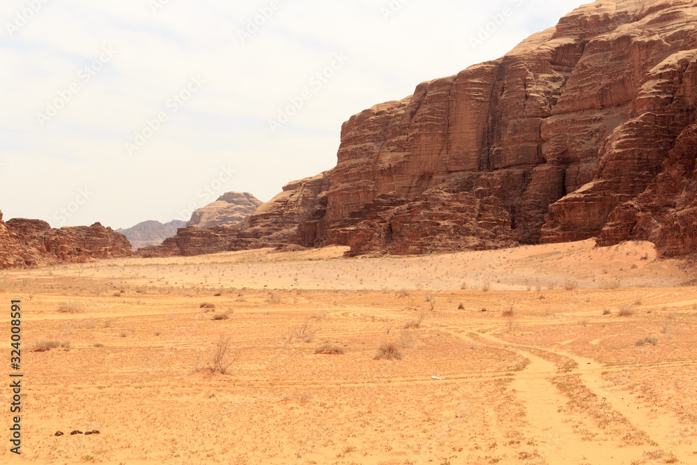 Wadi Rum desert panorama with dunes, mountains and sand, Jordan Wadi Rum desert panorama with dunes, mountains and sand, Jordan