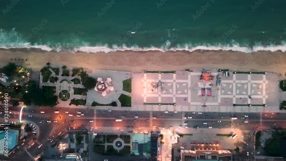 the flying camera takes off the beach with umbrellas and sunbeds where people walk and relax and the sea are worried the flying camera takes off the beach with umbrellas and sunbeds where people walk and relax and the sea are worried