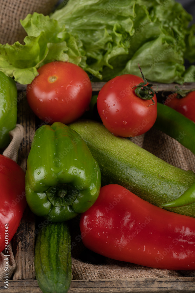 Green and red vegetables with tomatoes and cucumbers. Green and red vegetables with tomatoes and cucumbers.