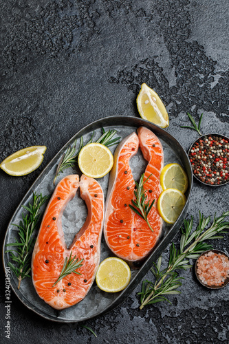 Salmon. Raw trout red fish steak with ingredients for cooking. Cooking Salmon, sea food. Healthy eating concept