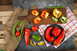 Variety of colorful peppers in a rustic space.