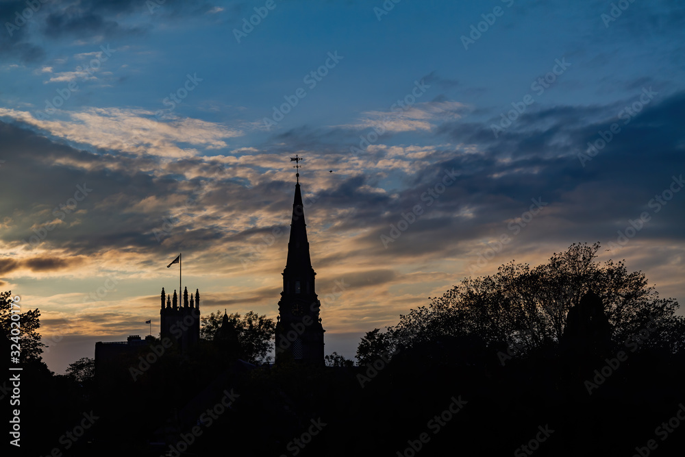 Obraz premium Afternoon shadow view of the tower of The Parish Church of St Cuthbert