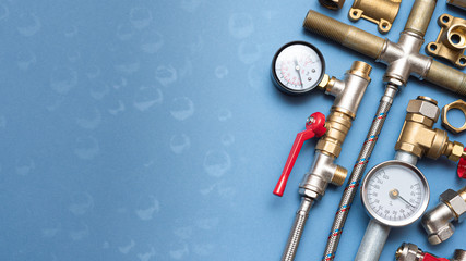 Plumber business card mockup. Plumbing accessories on blue background with copy space.