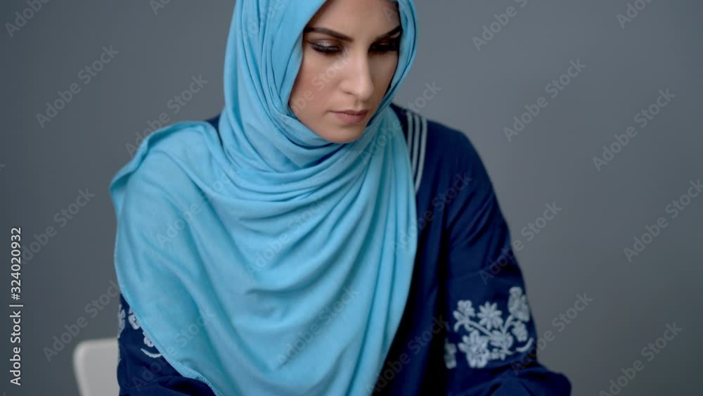 Female muslim student learning at home Female muslim student learning at home