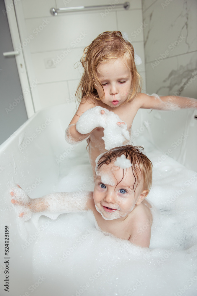 little brother and sister bathing in a foam bath Stock Photo Adobe Stock little brother and sister bathing in a foam bath Stock Photo Adobe Stock