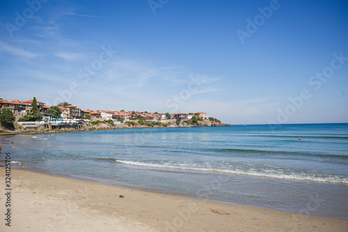 The sea coast of Bulgaria is a sandy beach with Golden sand and rocky high banks with tiled roofs of houses. The Balkan coast, the sea in Sozopol