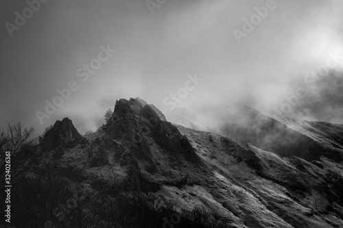 Mysterious black mountain with dramatic cloudy sky