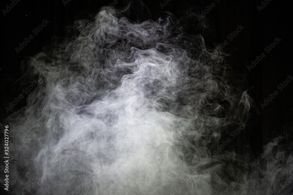 Naklejka White steam on a dark background.