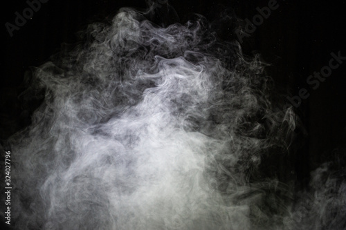 White steam on a dark background.