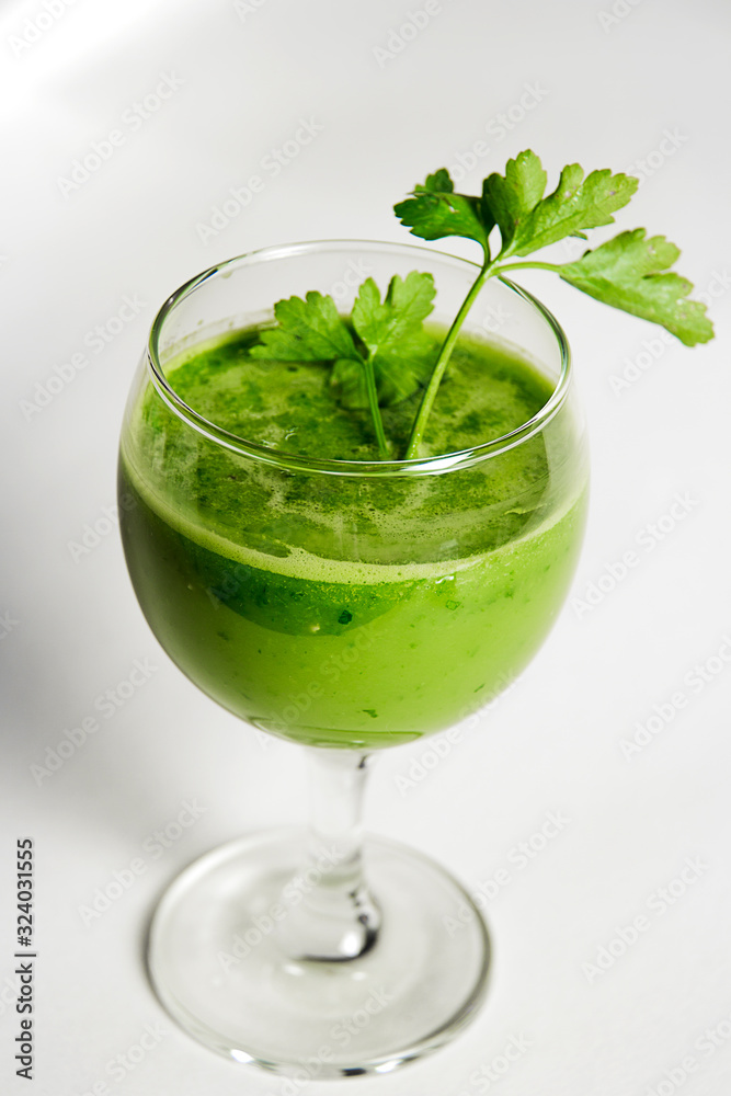 Green detox juice. Healthy smoothie from baby spinach, avocado, kiwi and parsley. Healthy eating concept. Green detox juice. Healthy smoothie from baby spinach, avocado, kiwi and parsley. Healthy eating concept.