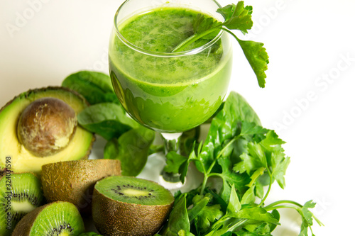 Green detox juice. Healthy smoothie from baby spinach, avocado, kiwi and parsley. Healthy eating concept.