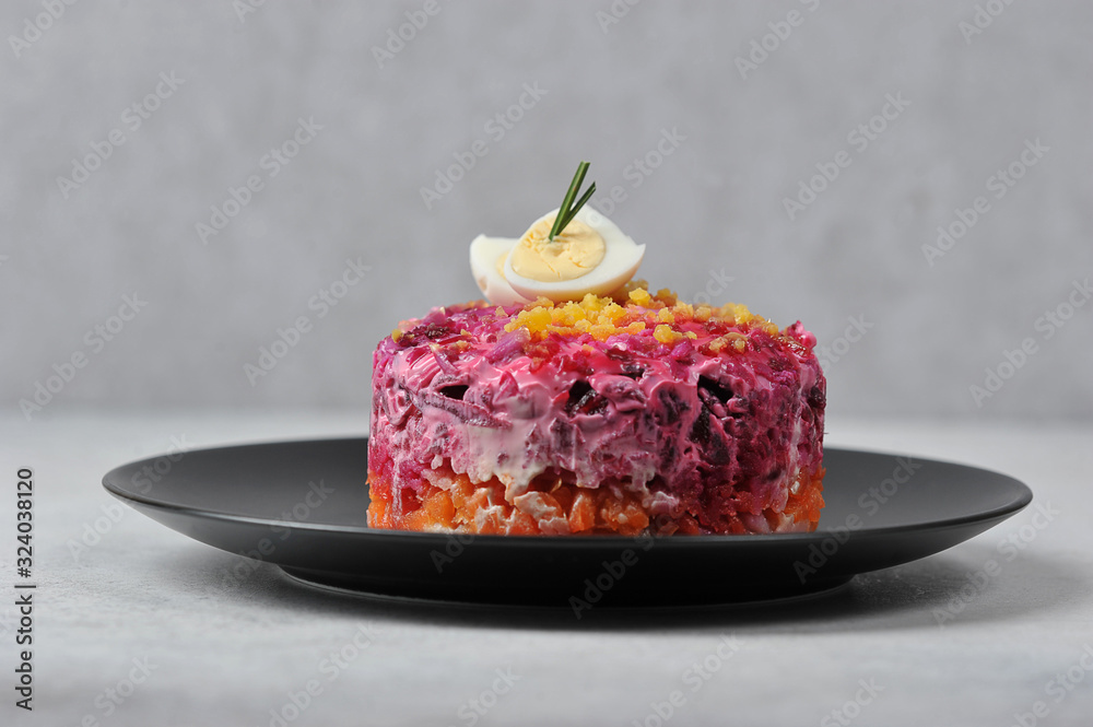 Fotografie Portion salad dressing herring under a fur coat