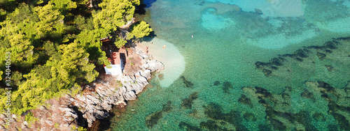 Aerial drone of paradise small islet with landmark chapel of Panagia in picturesque village of Parga, Ionian, Greece © aerial-drone