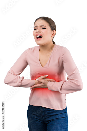 Young casual girl woman is having stomach ache. Over white background. Gosta abdominal pain. photo