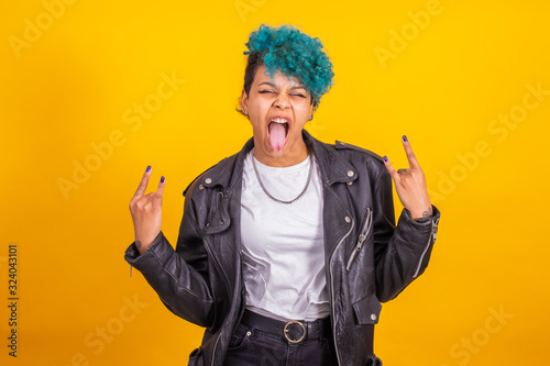 Fotografia modern young girl with rebel expression isolated on color background