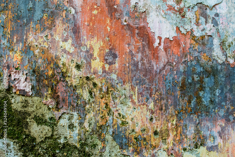 Close-up view of cracked paint layers on an old wall Close-up view of cracked paint layers on an old wall