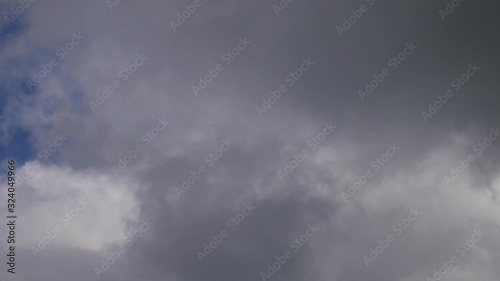 Gray clouds moving through the blue sky Gray clouds moving through the blue sky