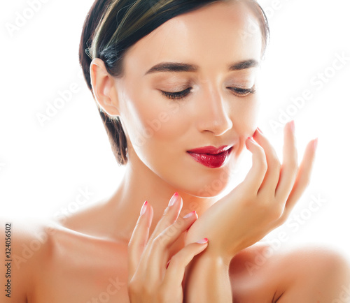 young pretty brunette woman with natural makeup posing cheerful with hands isoletad on white background, spa people concept photo