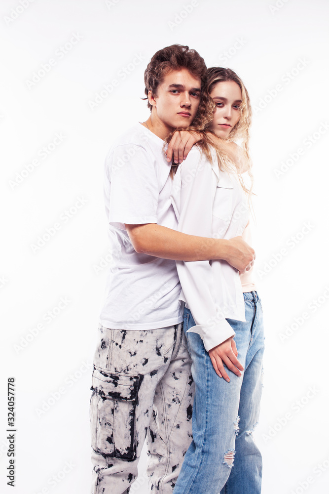 young pretty couple together posing cheerful isolated on white background, lifestyle people concept, happy boy and girl young pretty couple together posing cheerful isolated on white background, lifestyle people concept, happy boy and girl