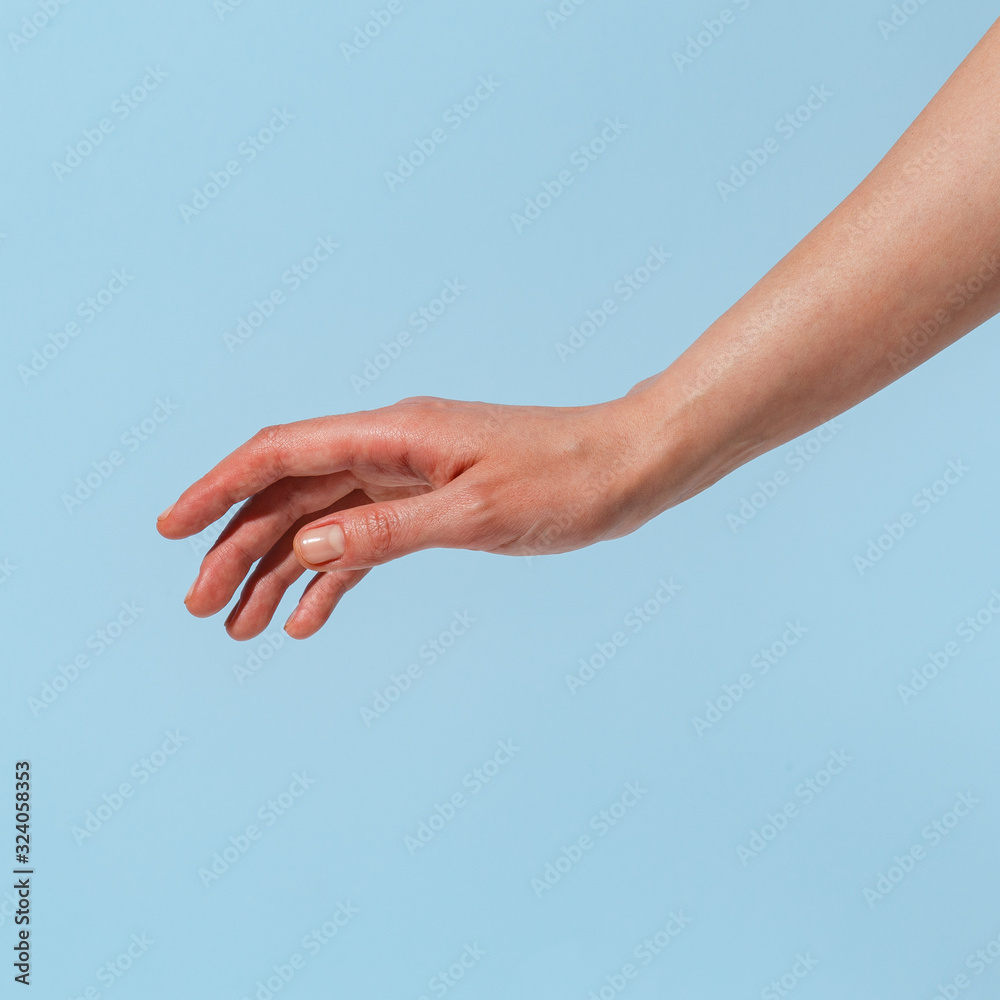 Female hand on a blue background in various positions. Female hand on a blue background in various positions.