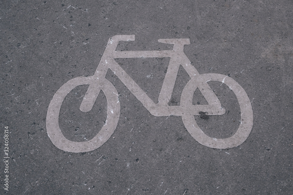 Bicycle path in the park. Sign for cyclists. Asphalt road. Cycling in the park. Marking for cyclists. Bicycle path in the park. Sign for cyclists. Asphalt road. Cycling in the park. Marking for cyclists.