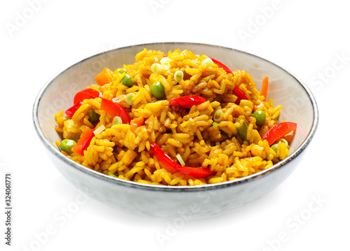 Delicious rice pilaf with vegetables isolated on white