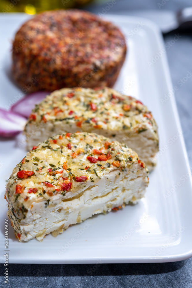 Different french soft goat cheeses made with spices and herbs Different french soft goat cheeses made with spices and herbs