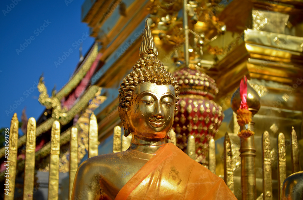 Close up of golden Buddha statue outside temple, Myanmar. Close up of golden Buddha statue outside temple, Myanmar.