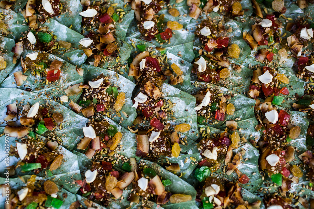 High angle close up of betel nuts wrapped in leaves on a street market.,Yangon High angle close up of betel nuts wrapped in leaves on a street market.,Yangon