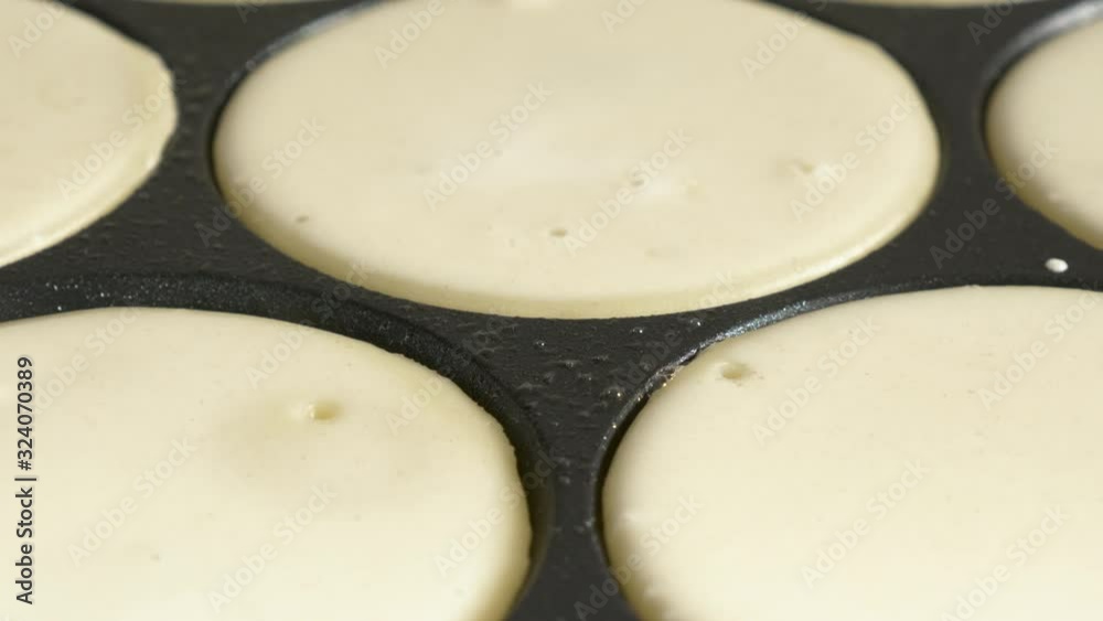 pancake frying pan with crepe pancake cooking on cooker in kitchen pancake frying pan with crepe pancake cooking on cooker in kitchen
