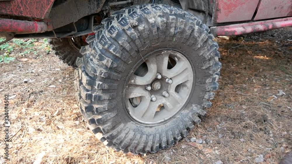 Mechanic rotates a free-wheeling wheel. Mechanic rotates a free-wheeling wheel.