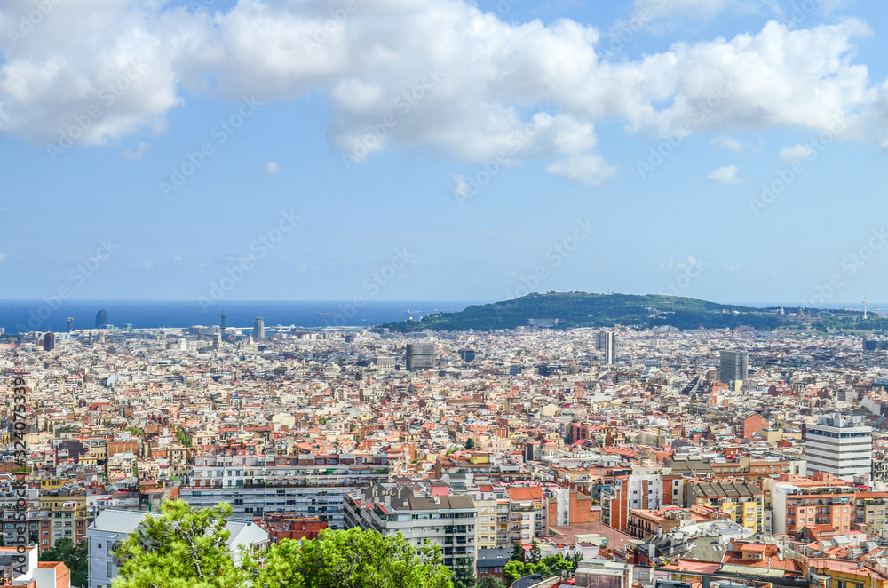 View of Spain's Barcelona from the Hill of Three Crosses in Guel Park on the Mediterranean Sea, New Town and Montjuic Mountain