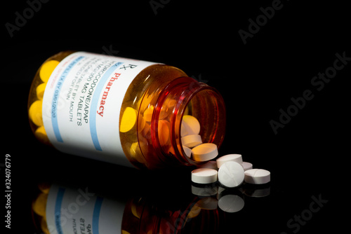 Hydrocodone/APAP Acetaminophen Prescription Bottle And Tablets photo