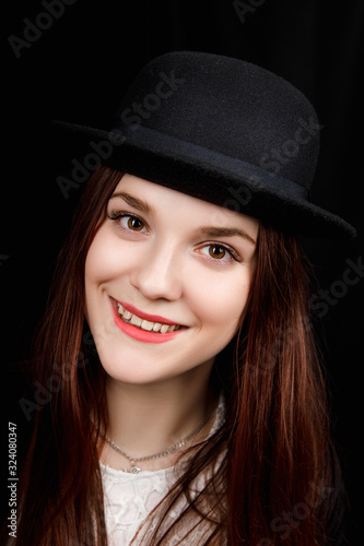 Beautiful woman portrait with a big hat. Vintage look. Fashion makeup. 