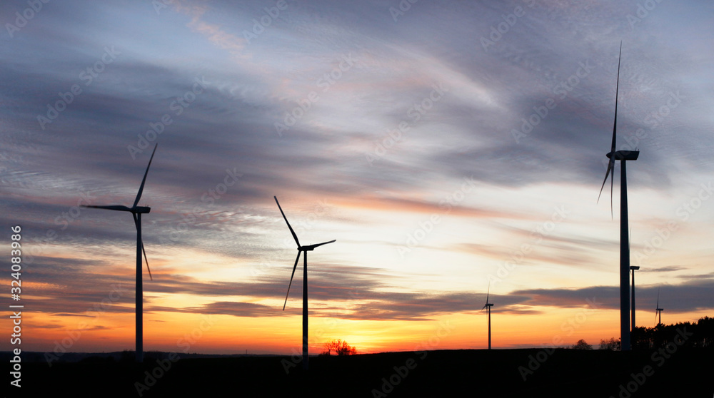 Obraz premium wind farm in fields at sunset near Stargard in Poland, beautiful landscape, natural colors