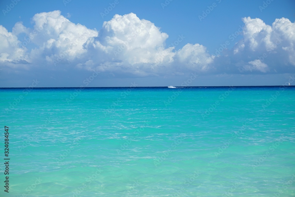 a cloud above turquoise ocean - obrazy, fototapety, plakaty 