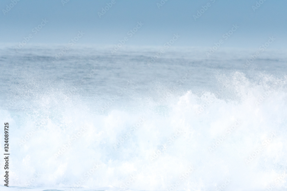 Surfer swallowed by a big wave on a beach on the north coast of Spain Surfer swallowed by a big wave on a beach on the north coast of Spain