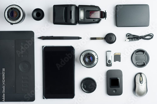 Flat assembly composition with photographic production equipment, , on black background. Top view