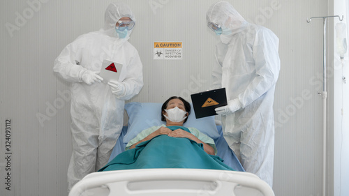 Photography coronavirus covid-19 infected patient on bed with desease control experts checki