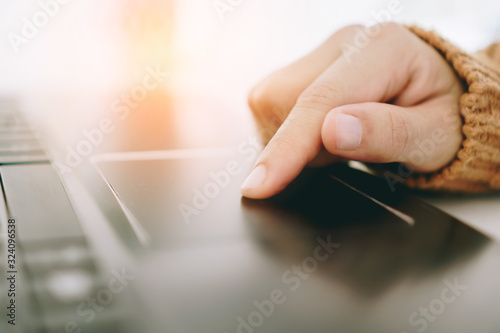 Woman hand using laptop or smartphone to work study on work desk with clean nature background background. Business, financial, trade stock maket and social network.