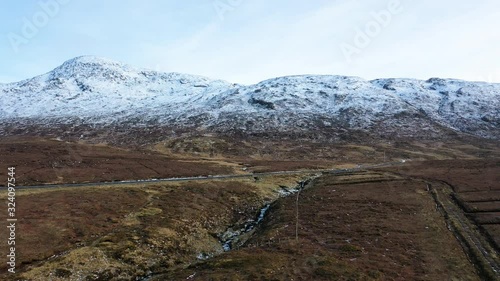 Flying next to the R251 Highway close to Mount Errigal, the highest mountain in Donegal - Ireland photo