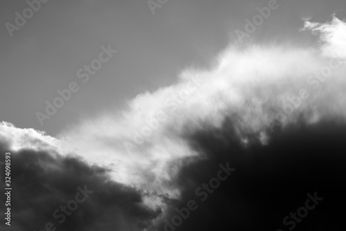 Storm clouds up close during summer in black and white abstract